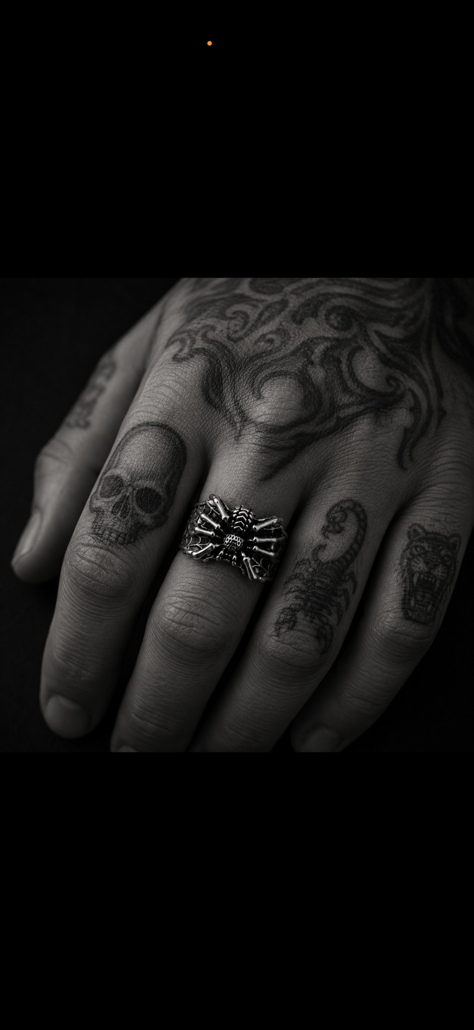 A hand wearing a sculptural silver ring